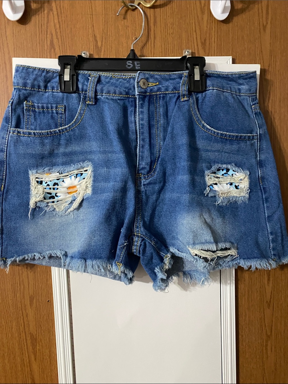 Blue Distressed Denim Jean Shorts with Floral Patch Accents